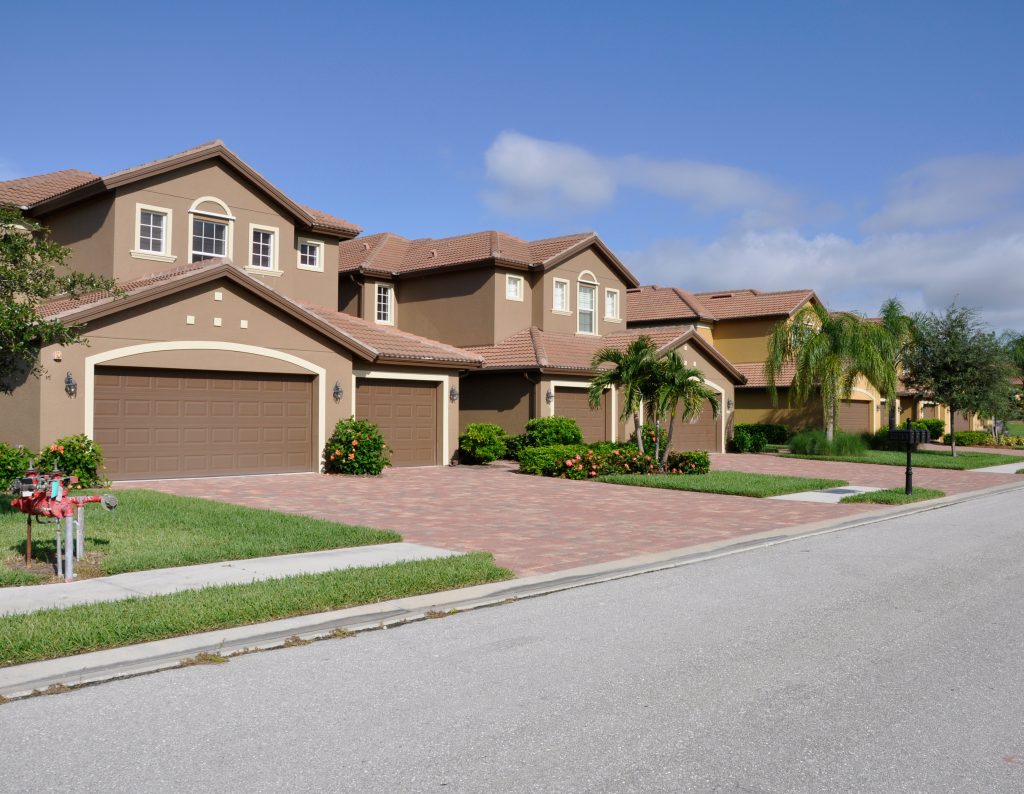 Row of typical new modern homes in a neighborhood in Naples Florida